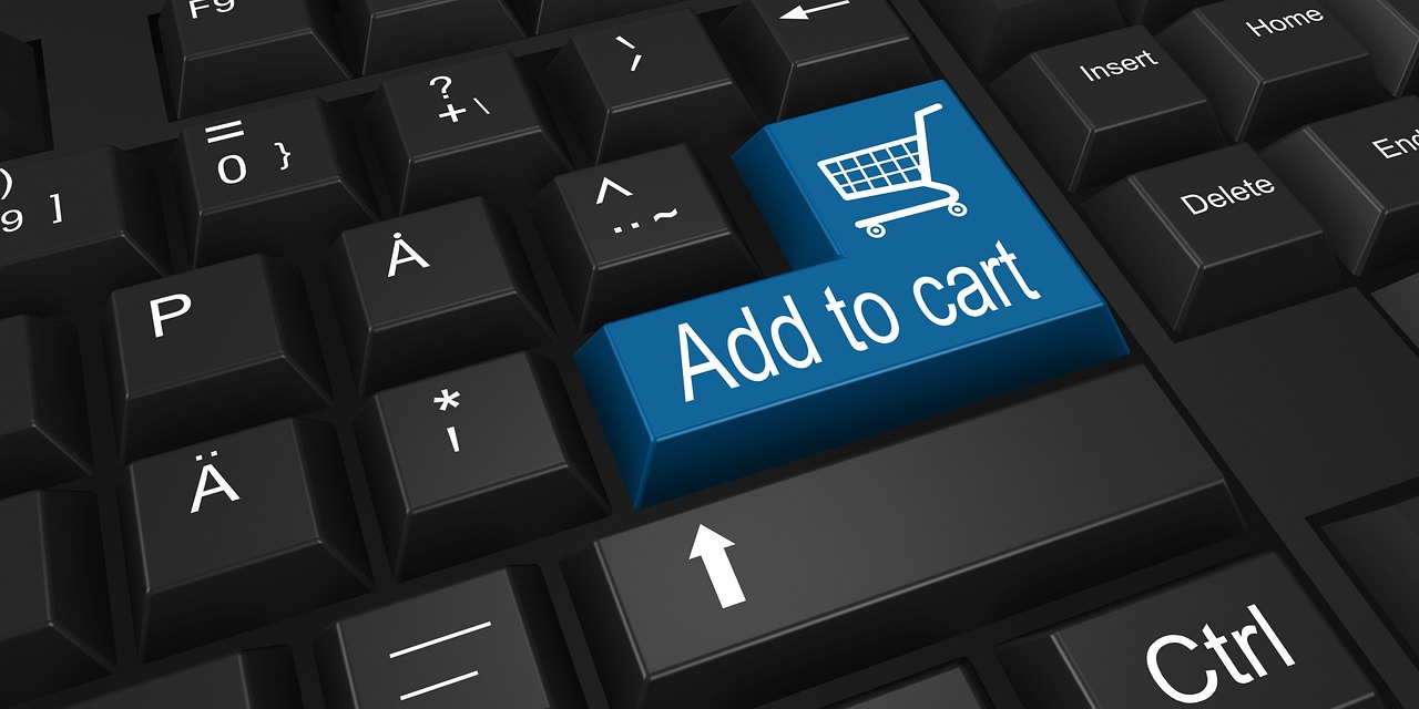 Close-up of a keyboard with a blue “Add to cart” key, symbolizing the importance of a fast, seamless checkout experience enabled by speed optimization for Shopify stores.