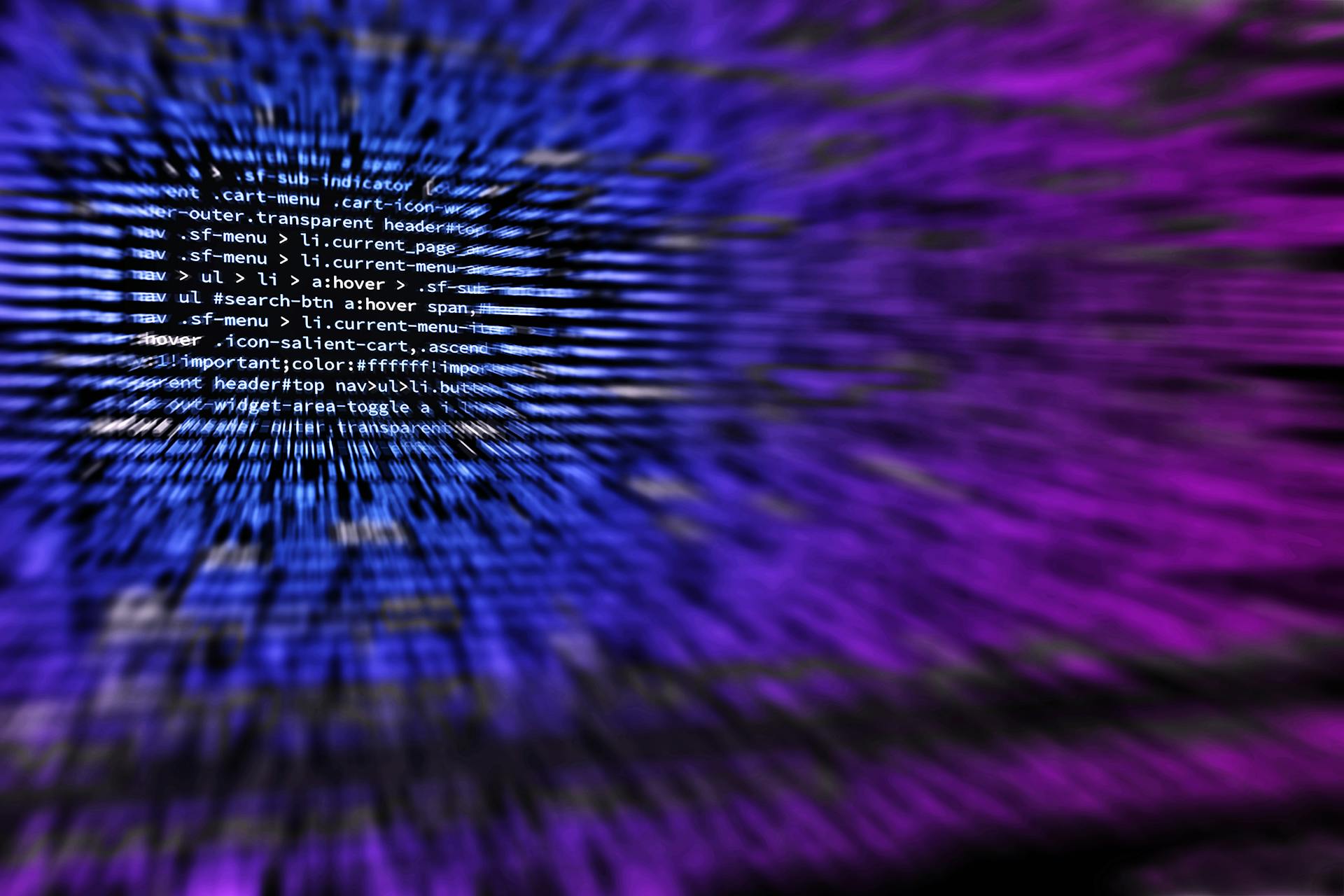 Tracking Pixels That Convert: How to Use Them Effectively 18 Abstract view of computer code with a zoom effect in blue and purple tones, symbolizing tracking code, HTML snippets, and the technical side of pixel tracking.