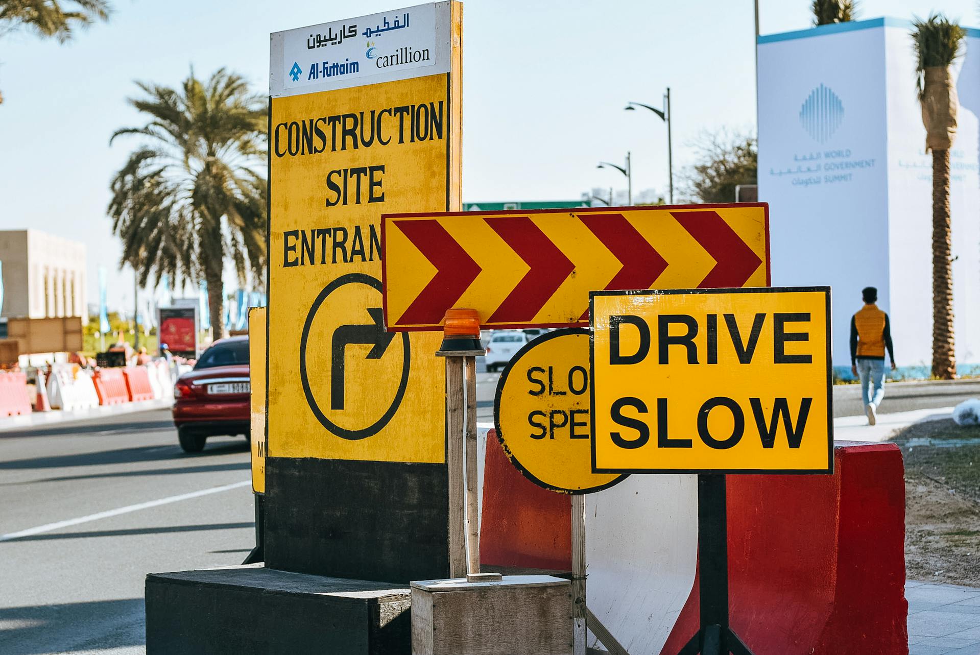 Drive Slow and construction warning signs on a road—symbolizing slow site speed and performance bottlenecks that hurt paid ads and PPC campaign conversions.