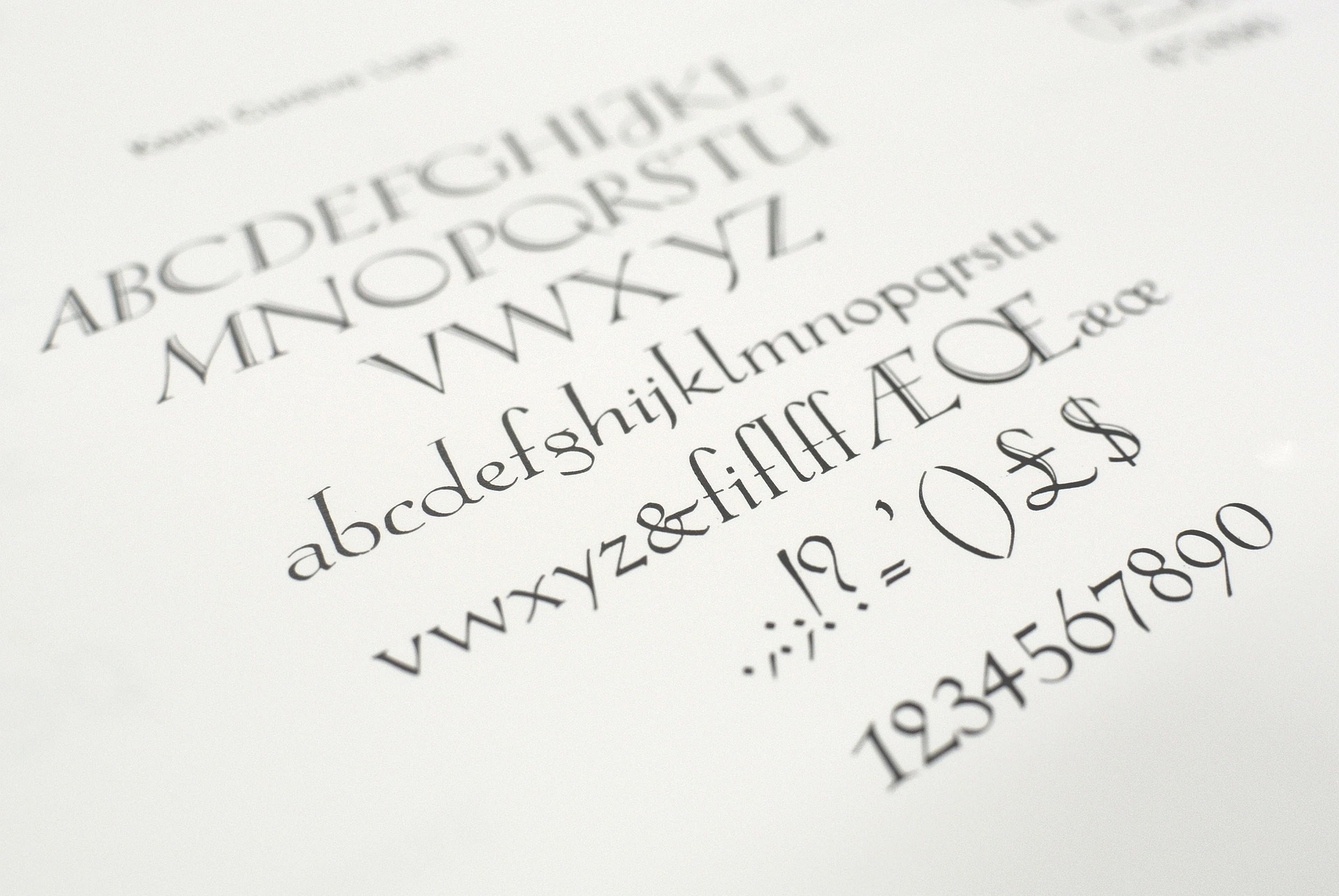 A close-up of a serif typeface character set, including uppercase and lowercase letters, ligatures, and symbols—demonstrating the design variety and character coverage in high-quality web fonts.