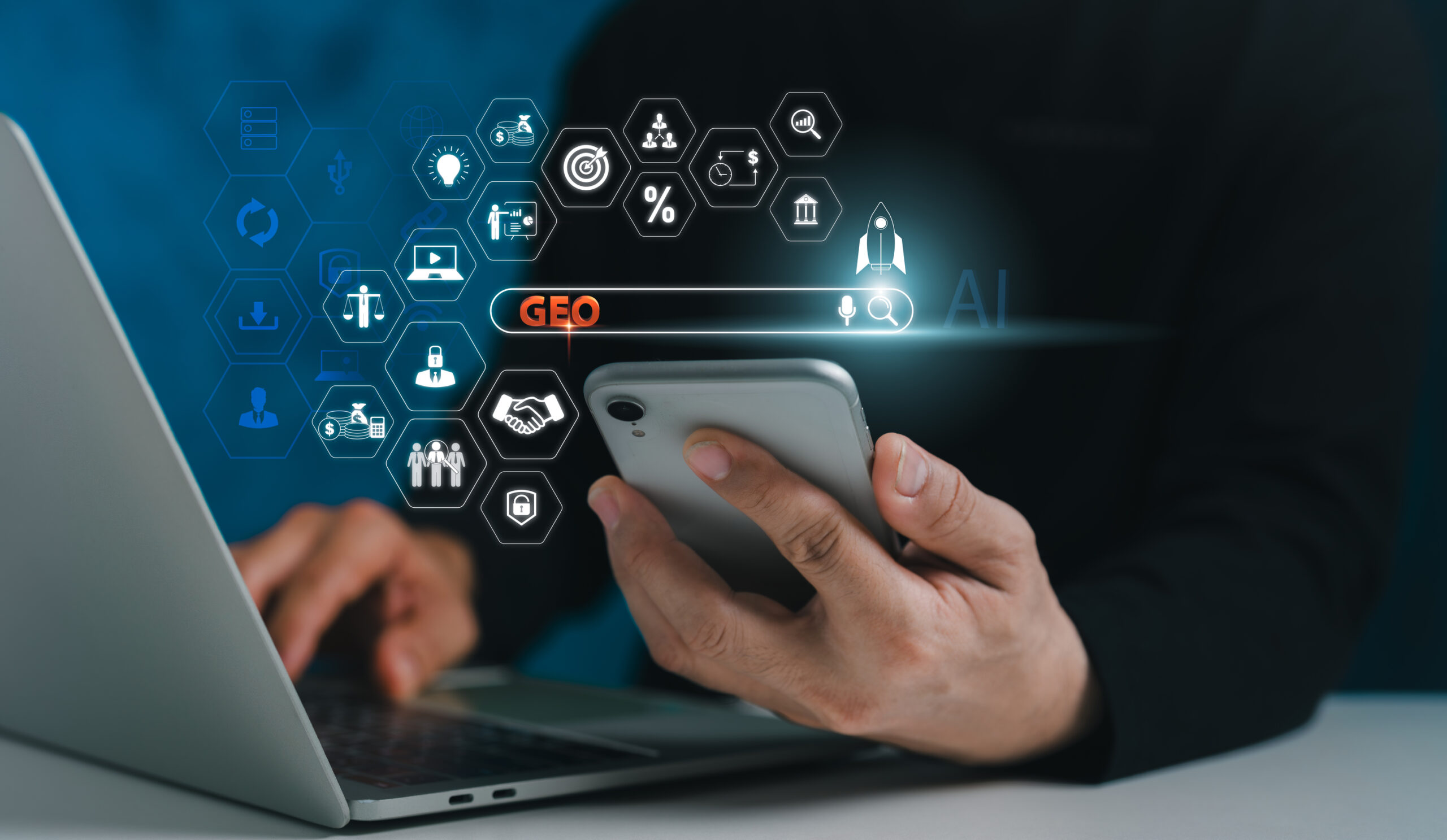 Person using a smartphone and laptop with digital interface icons and the word ‘GEO’ in a virtual search bar—illustrating the concept of generative engine optimization in the context of AEO vs GEO.
