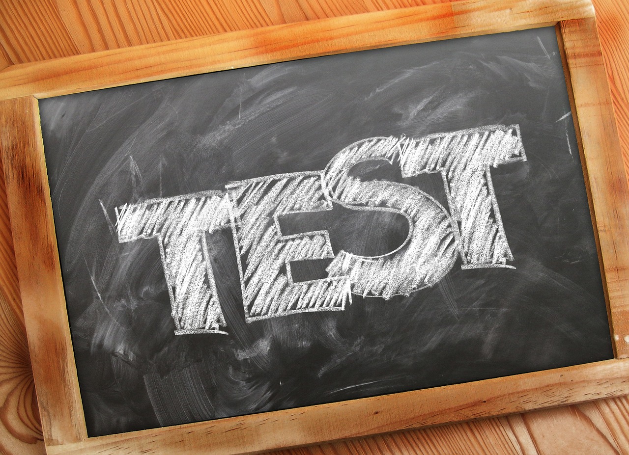 Chalkboard with the word ‘TEST’ written in bold, representing A/B testing as a core strategy in Ecommerce Conversion Optimization to improve performance and increase conversion rate.