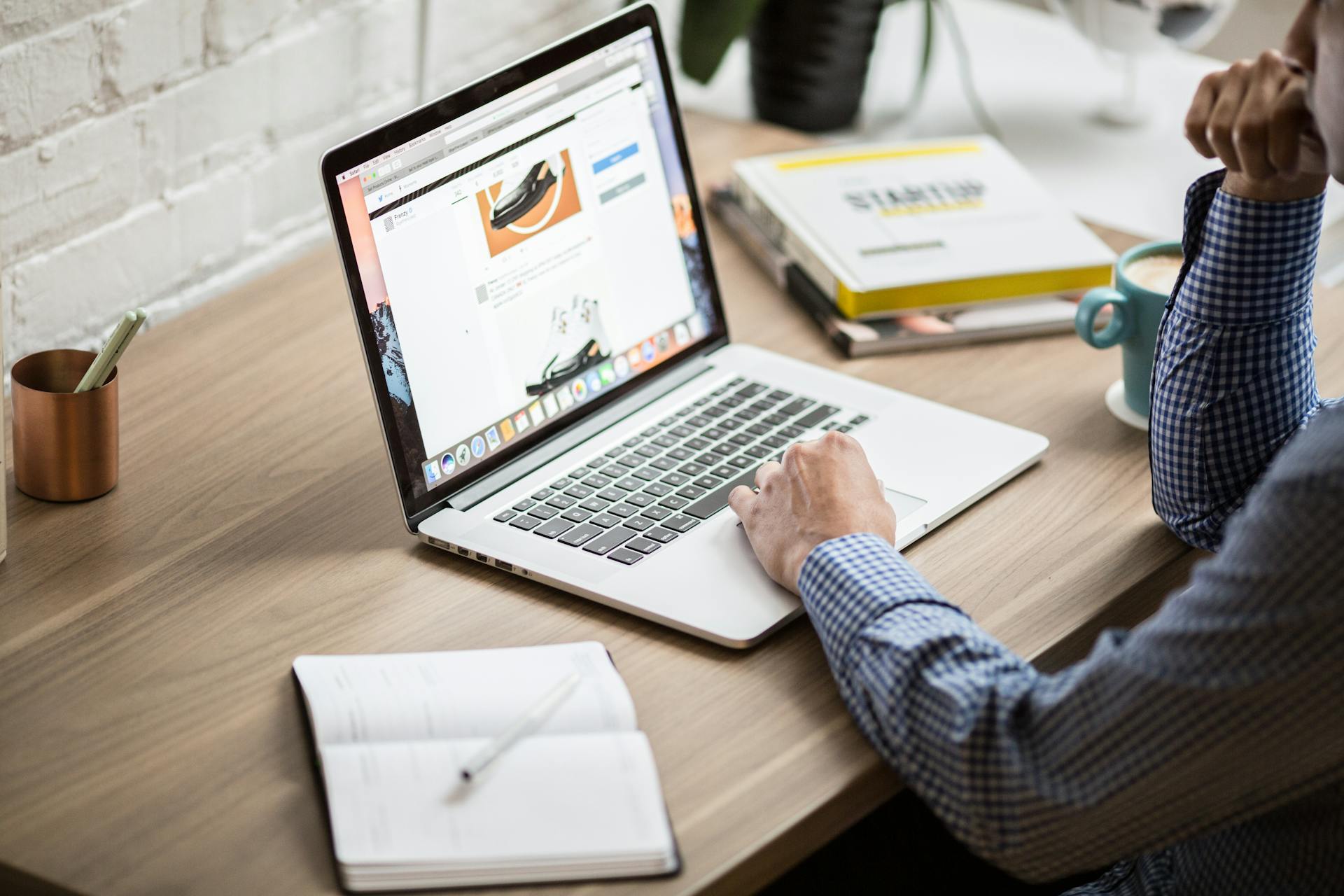 Online shopper browsing product page on laptop, illustrating ecommerce conversion optimization, product page design, and digital customer journey.