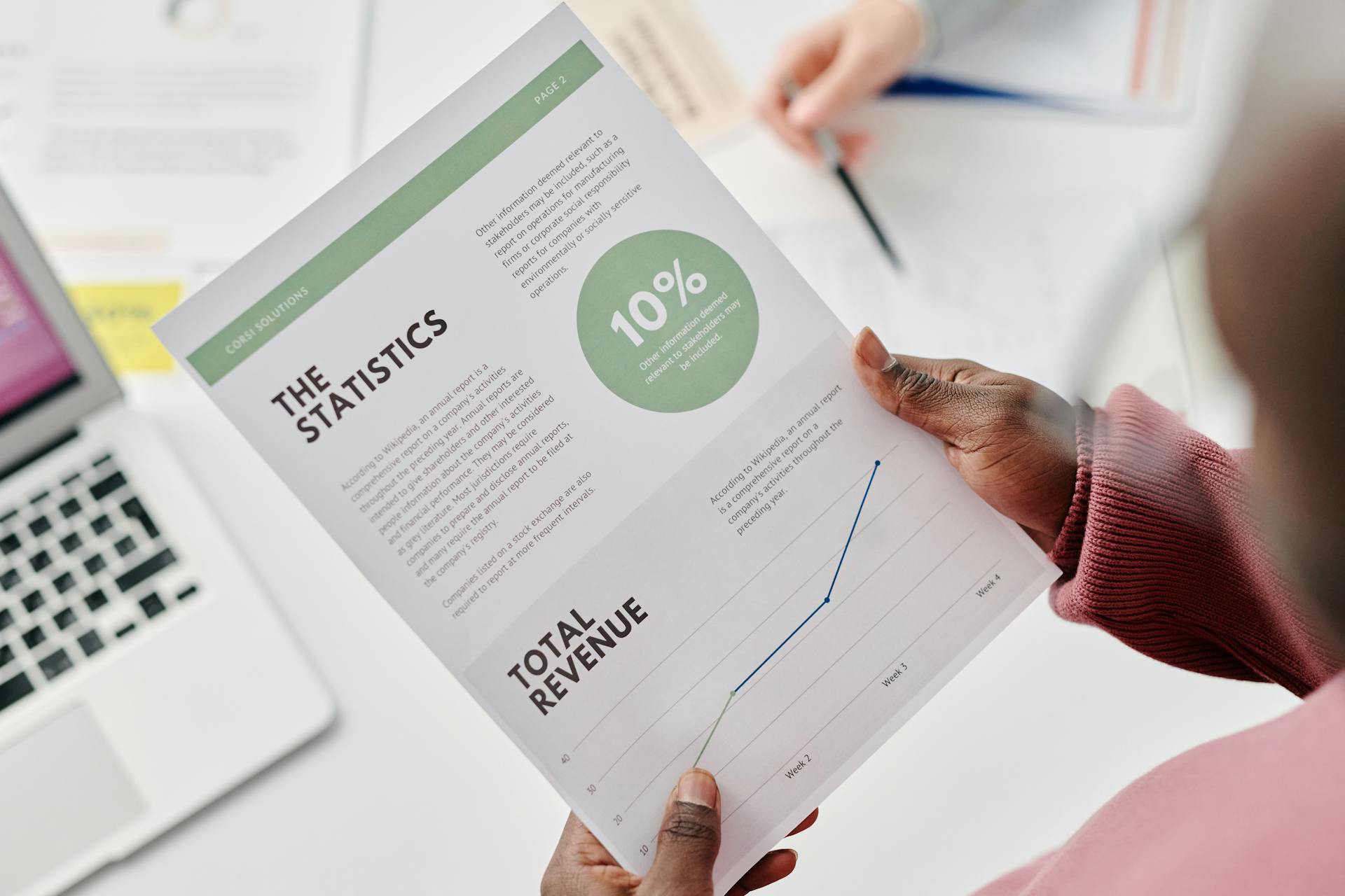 Business professional reviewing analytics report with revenue growth chart, illustrating ecommerce conversion optimization and performance tracking.