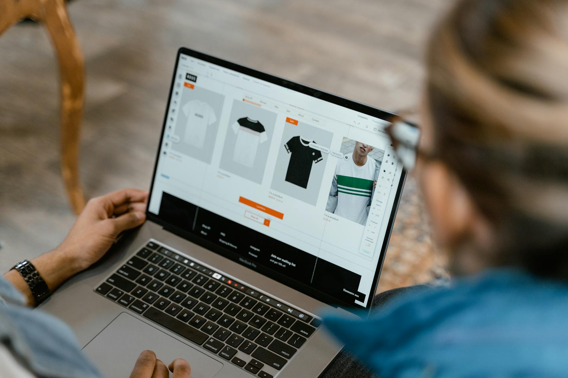 Person browsing ecommerce product page on laptop, representing Shopify revenue optimization and online store performance