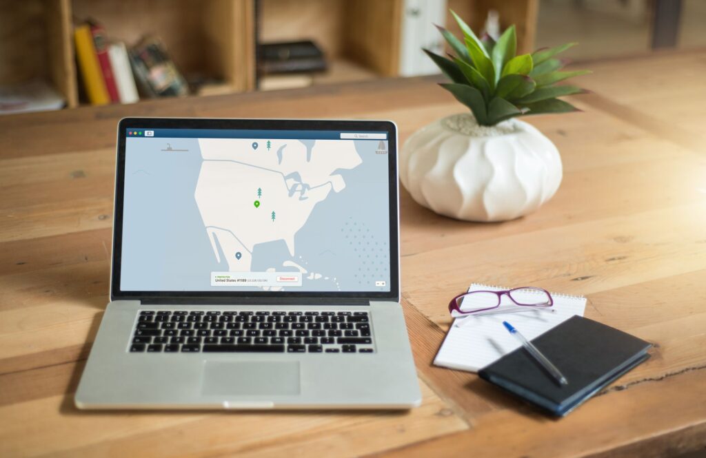 Laptop displaying a global content delivery network map illustrating how edge servers deliver website content faster worldwide