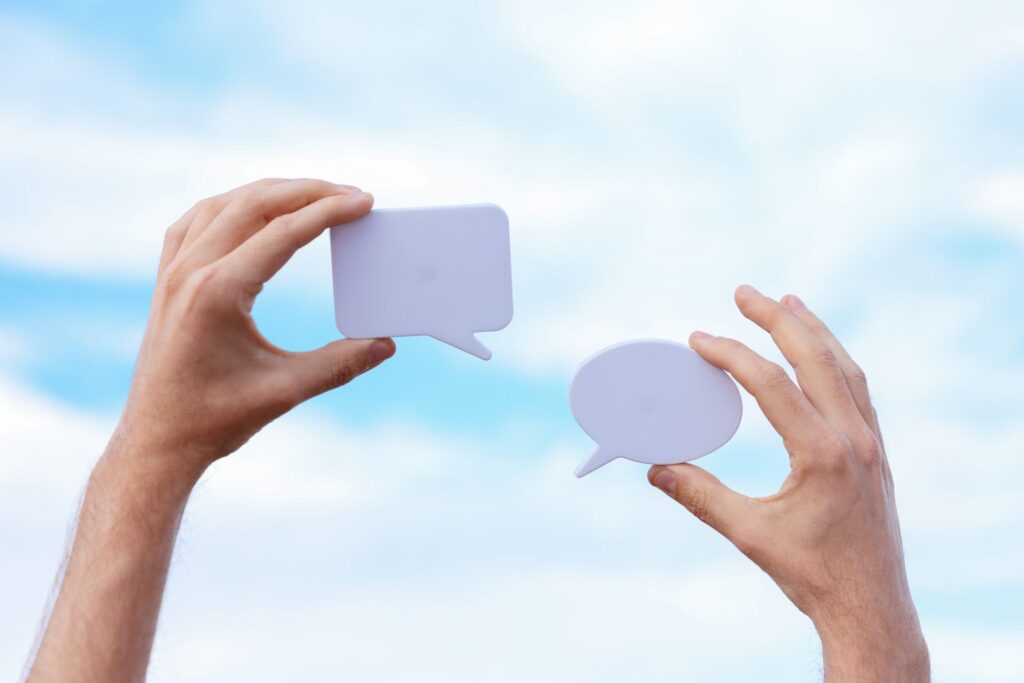 Shopify chat app illustration showing two speech bubbles representing live customer conversations and real-time support.