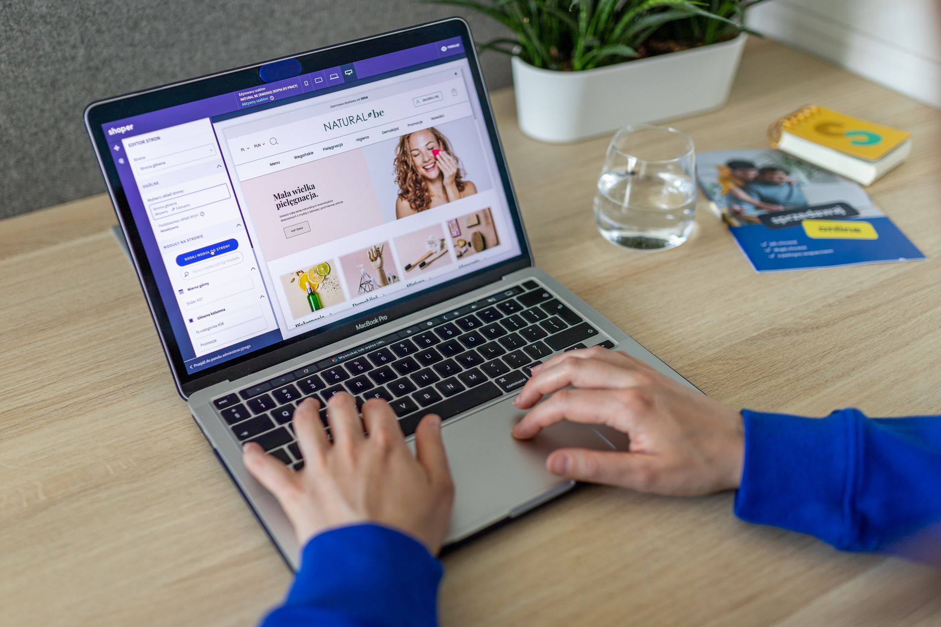 Person editing an online storefront on a laptop, showing how a Shopify page builder gives merchants more control over page layouts and design.